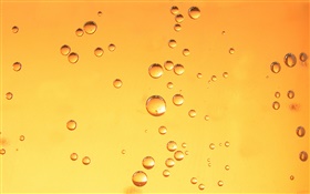 水滴、オレンジ色の背景 HDの壁紙